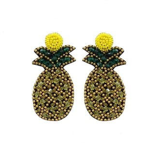 May include: A pair of gold, green, and yellow beaded pineapple earrings. The earrings are made of small beads that are sewn together to create the shape of a pineapple.