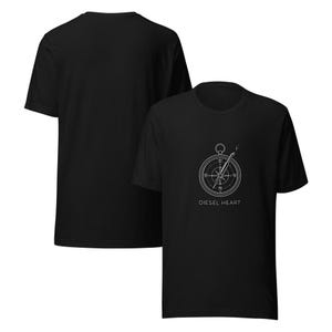 May include: Black t-shirts with a white compass design and the text "DIESEL HEART". The compass graphic is centered on the front of the shirt. One shirt is displayed in front of another.