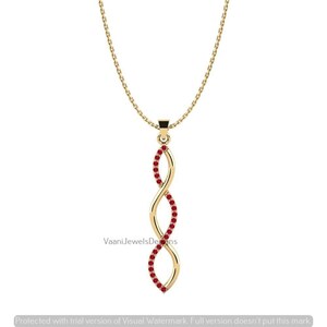 May include: A gold pendant necklace featuring a vertical, twisted double-helix design. One side of the metal structure is set with small, round, red gemstones. The pendant hangs from a delicate gold chain. The text VaaniJewelsDesigns is visible.