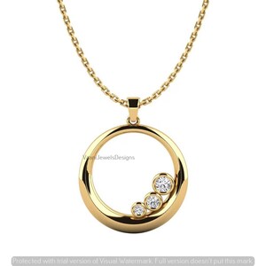 May include: A gold necklace featuring a circular pendant with a polished finish. The pendant is accented with three round, clear, faceted stones set in a diagonal line along the lower right inner edge of the circle, suspended from a gold chain.
