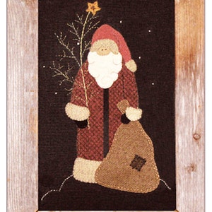 May include: A framed felt appliqué of Santa Claus carrying a sack of gifts. He is wearing a red suit with white trim and a white beard. The background is black with white snowflakes.