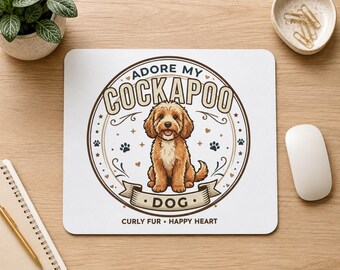 May include: A rectangular white mousepad featuring a circular graphic with a brown Cockapoo dog in the center. The text reads ADORE MY COCKAPOO DOG and CURLY FUR HAPPY HEART. The design includes small paw prints, hearts, and decorative swirls in brown.