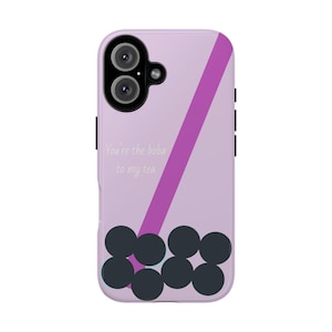 May include: A lavender phone case with a purple diagonal stripe and dark gray boba pearls at the bottom. The text "You're the boba to my tea" is printed in white.