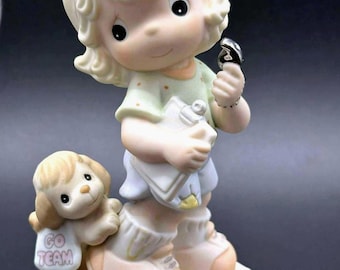 Precious Moments Cheerleader Figurine with Puppy.