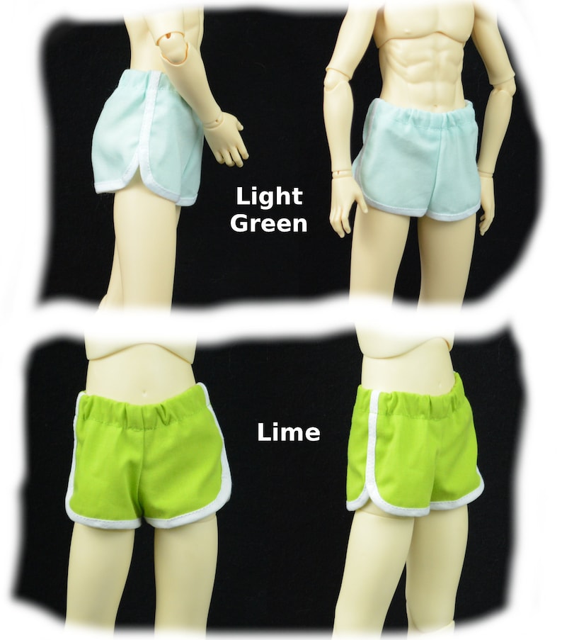 May include: Two pairs of athletic shorts with white piping. The shorts on the top are light green and the shorts on the bottom are lime green.