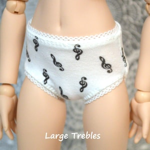 May include: White cotton underwear with a black treble clef print and a lace trim.
