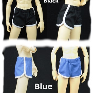 May include: Two pairs of athletic shorts with white piping. One pair is black and the other is blue.