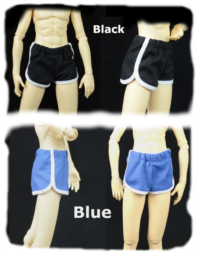 May include: Two pairs of athletic shorts with white piping. One pair is black and the other is blue.
