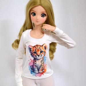 May include: A white long-sleeved shirt with a colorful watercolor cheetah print. The shirt has a round neckline and is made of a soft, comfortable fabric.