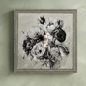 May include: A square light switch cover plate featuring a monochromatic, painterly illustration of a rose bouquet in shades of gray, white, and black. A metallic toggle switch with the letters ON is centered vertically over the floral design.