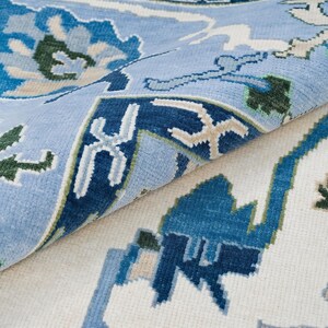 Side angle showing the low-profile, sleek finish of the blue rug 8x10 wool pile.