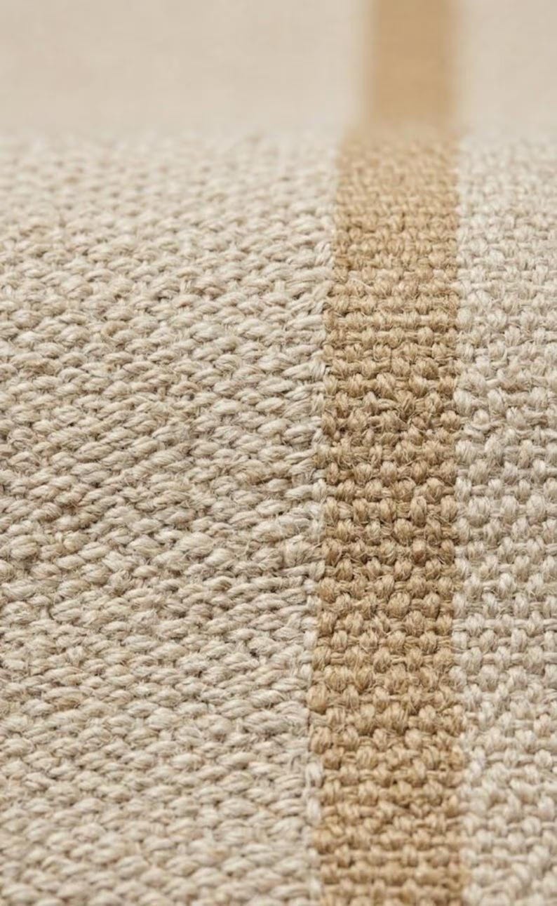 Ambient lifestyle shot showing the striped runner rug grounding a chic wooden hallway, acting as a serene and structured focal point unlike a busy scalloped rug or moroccan rug black and brown.