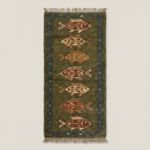 Macro perspective of the dense Oushak runner rug texture, showing the royal blue zigzag border of this luxury wool area rug.