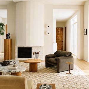 Side angle perspective view of the plush neutral rug, showing its rich pile depth and luxurious Teppich Wohnzimmer presence.