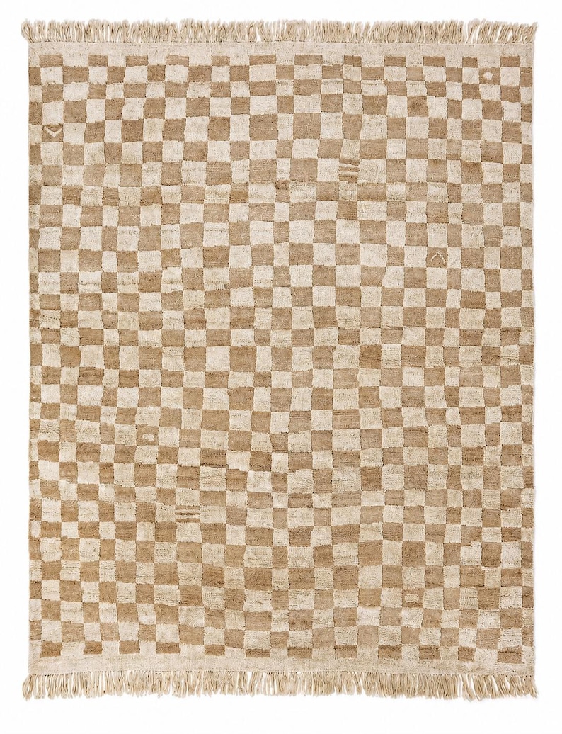 Detailed view of the alternating neutral cream and beige squares on the minimalist rug, emphasizing high-end handcrafted rugs symmetry.