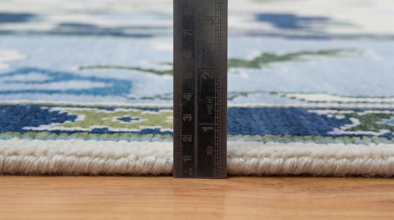 The rugs for living room styled in a bright, modern interior to show its grand scale and airy feel.