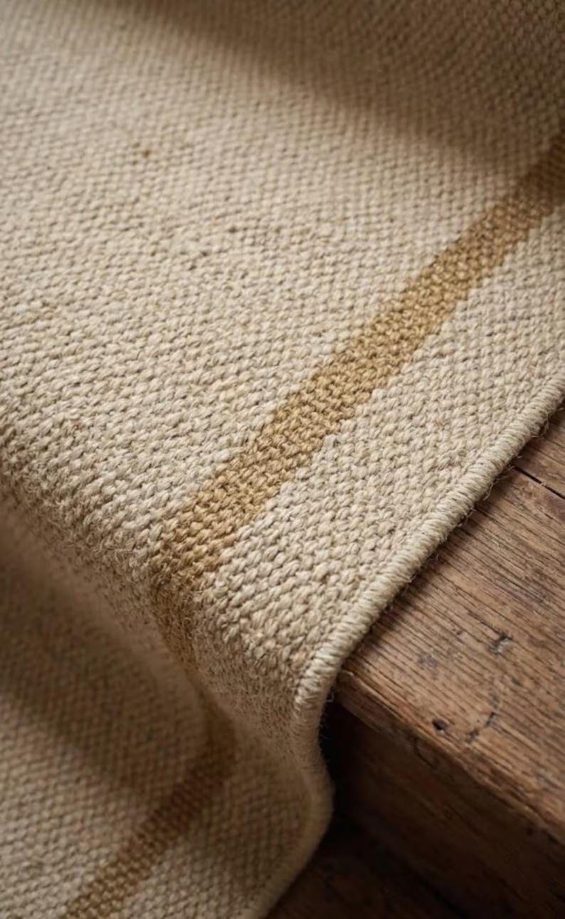 Wide perspective capturing the striking minimal cream and tan contrast, establishing this custom size runner as a premium handcrafted Wollteppich alternative to a mass-produced pottery barn franklin rug.