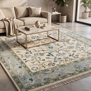 High-resolution shot showing the wide powder blue main border and light blue outer band of this turkish rug.