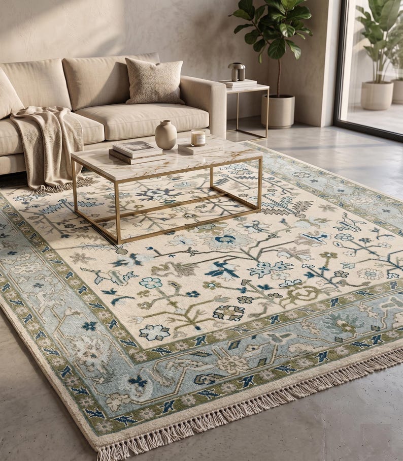 High-resolution shot showing the wide powder blue main border and light blue outer band of this turkish rug.