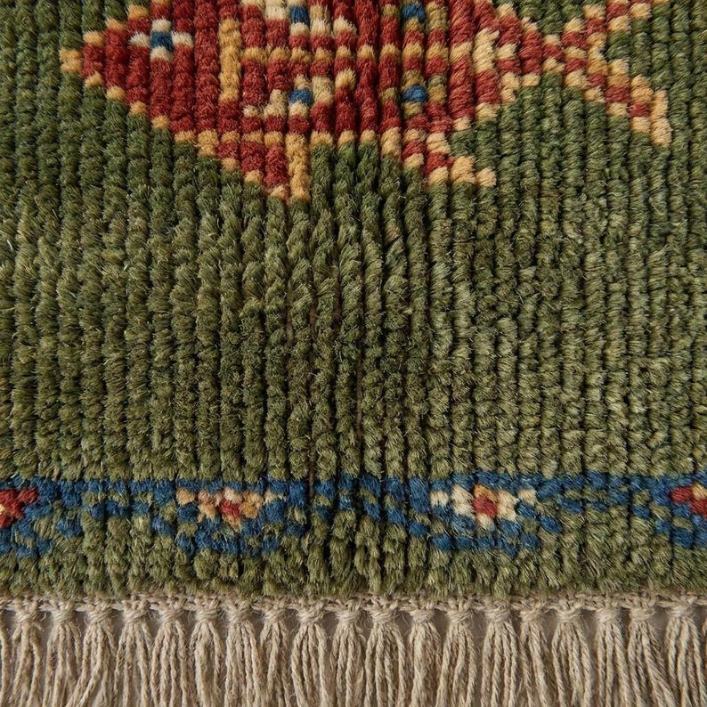 Detail of the twisted cotton fringes and plush Oushak rug pile, showcasing the true artisanal quality of these handcrafted rugs.