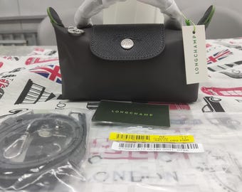 Longchamp matte black mini crossbody bag features an adjustable shoulder strap; compact and portable, it makes the perfect gift for her.