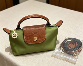 Longchamp green mini crossbody bag, with an adjustable shoulder strap, is small and portable, making it the perfect gift for her