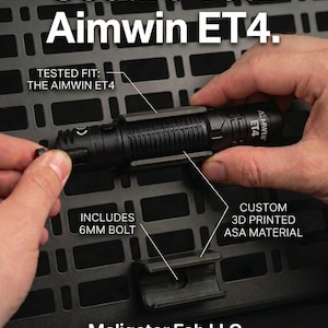 May include: A black 3D printed ASA material mount for an Aimwin ET4 flashlight, featuring a 6mm bolt. The text reads: Secure Your Aimwin ET4. TESTED FIT: THE AIMWIN ET4. CUSTOM 3D PRINTED ASA MATERIAL. INCLUDES 6MM BOLT. Maligator Fab LLC.