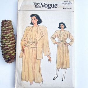 May include: A vintage sewing pattern for a two-piece outfit. The pattern is for sizes 14-18 and is from Very Easy Vogue. The pattern features a long-sleeved jacket with a tie at the waist and a skirt.