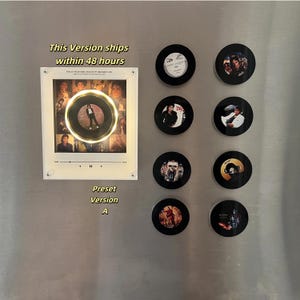 May include: A rectangular white acrylic frame featuring a central circular cutout with a gold rim, displaying a collage of Michael Jackson images and a music player interface. Eight circular black magnets with various Michael Jackson album art designs.