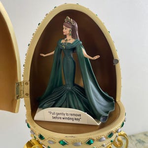 Avon Empress of Emeralds Musical Resin Egg (2000), "Barbie (Caucasian)" "Minuet by Mozart"; NIB