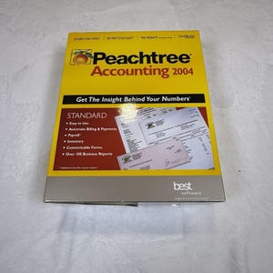 May include: A yellow and maroon software box for Peachtree Accounting 2004. The front features a peach graphic, the text Get The Insight Behind Your Numbers, and a list of features including Easy to Use, Automate Billing, and Payroll.