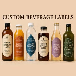 May include: Six glass bottles of various shapes and colors, each featuring a custom beverage label with the text CUSTOM BEVERAGE LABEL, YOUR BRAND, and PREMIUM QUALITY MADE FOR YOU. The bottles contain different colored liquids and have black or white caps.
