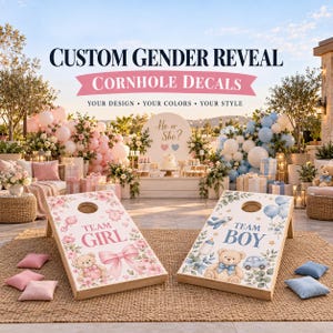 May include: Two wooden cornhole boards featuring custom decals. The left board displays pink floral accents, a teddy bear, a bow, and the text 'TEAM GIRL'. The right board features blue botanical elements, a teddy bear, and the text 'TEAM BOY'.
