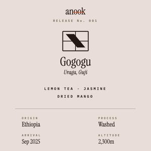 May include: A light beige coffee label featuring the text anook RELEASE No. 001, a black square logo, and the name Gogogu Uraga, Guji. It lists flavor notes of lemon tea, jasmine, and dried mango, with origin Ethiopia, washed process, and 2,300m altitude.
