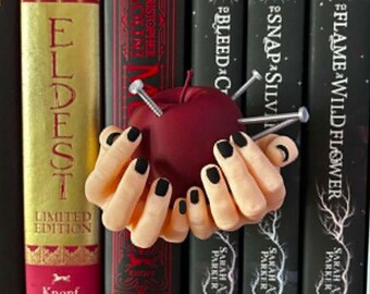 apple with nails, mindf*ck, book shelf decor, book gift, book lover, thingy thingz, hands holding apple, apple decor, bookish gift