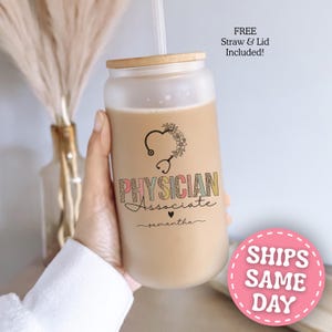 May include: A frosted glass tumbler with a bamboo lid and straw. The glass features a black stethoscope graphic shaped like a heart with floral accents, the text "PHYSICIAN ASSOCIATE" in a leopard print pattern, and the name "samantha" in script.