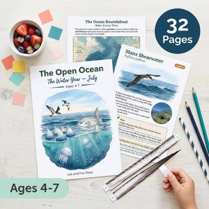 May include: Educational activity pages titled The Open Ocean and Manx Shearwater featuring watercolor illustrations of marine life, jellyfish, and birds. Includes a bowl of berries, colored pencils, and a feather-shaped paper craft for ages 4-7.