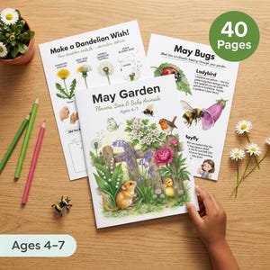 May include: A children's activity book titled "May Garden" with illustrations of flowers, bees, and baby animals. The book is open, revealing colorful pages with text and images. The cover text reads "Flowers, Bees & Baby Animals Ages 4-7".
