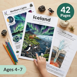 May include: Educational printables about Iceland and the Northern Lights for ages 4-7. The pages feature illustrations of the aurora borealis, puffins, and geysers. Includes a set of colored pencils and a small puffin figurine. The text on the pages reads "Iceland" and "Northern Lights".