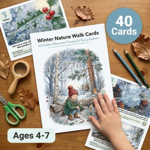 May include: Winter Nature Walk Cards set featuring 40 outdoor observation prompts for young explorers. The cards display watercolor illustrations of winter scenes, including a child in a green coat, a squirrel, a robin, and holly berries.