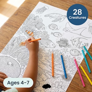 May include: A black and white coloring page featuring various sea creatures, including fish, a turtle, and a stingray. The page is being colored with orange, blue, pink, and yellow pencils. The text "28 Creatures" and "Ages 4-7" are visible.