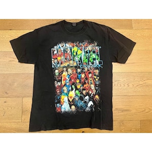 May include: Black Marvel Comics t-shirt featuring a collage of comic book characters. The word "Marvel" is printed in a colorful, stylized font across the top. The shirt is made of a soft material and has short sleeves.