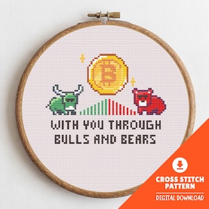 May include: Cross-stitch pattern in a wooden hoop featuring a Bitcoin coin, a green bull, and a red bear. The text "WITH YOU THROUGH BULLS AND BEARS" is stitched below. The design includes a digital download icon.