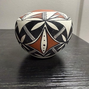 May include: A set of three ceramic mugs with a speckled, matte finish. The mugs are in shades of cream, light gray, and dark gray. Each mug has a simple, minimalist design, perfect for coffee or tea.