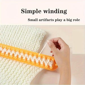 May include: An orange plastic knitting loom with a row of pegs, featuring white yarn woven in a zigzag pattern. The text "Simple winding" and "Small artifacts play a big role" is printed above the loom and the white knitted fabric.
