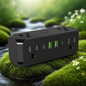 May include: A black power strip with multiple outlets and USB ports. The power strip has a rectangular shape with rounded edges. The USB ports glow green. The power strip is sitting on a bed of green moss.