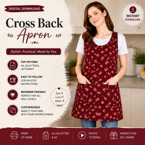 May include: A burgundy cross-back apron with a floral design, worn over a white top and jeans. The apron has two front pockets. The image includes the text "Cross Back Apron" and "Stylish. Practical. Made by You."