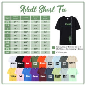 May include: A size chart for adult short tees, with measurements in inches for chest, shoulder width, and sleeve length. The image displays a black t-shirt and a color palette including white, black, red, and other colors. The shirts are 100% cotton.