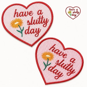 May include: Two heart-shaped embroidered patches. The patches are light pink with a red border. Each patch has the phrase "have a slutty day" in red script, along with a yellow flower with green stem and leaves.
