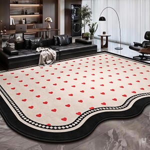 Modern designtapijt met hartprint en zwarte rand – luxe statementtapijt